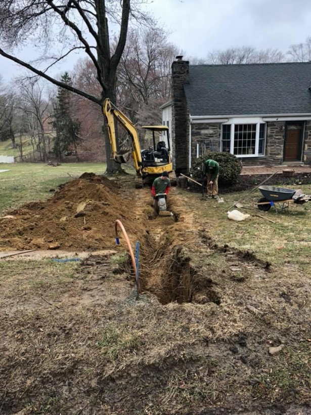 Professionals from Antrim Plumbing replacing a busted sewer system, Sewer Replacement Services in The Delaware County, PA