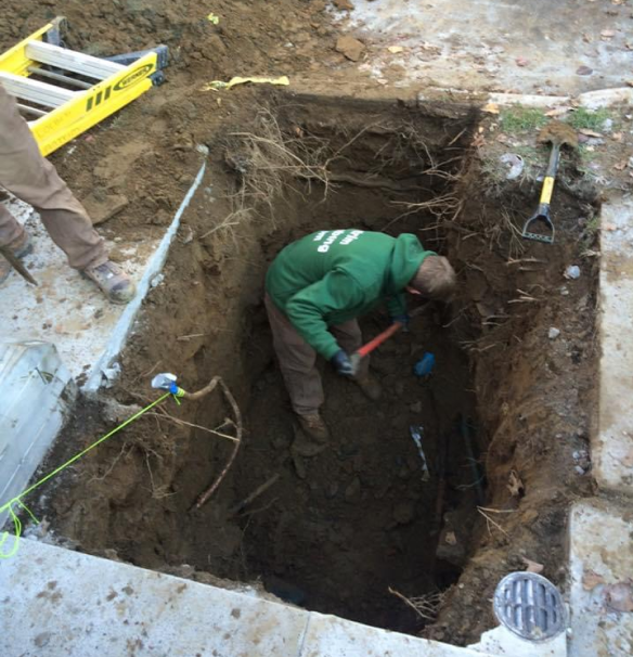 An Antrim Plumbing staff locating a sewer system to do a repair. Sewer Repair Services in Delaware County, PA