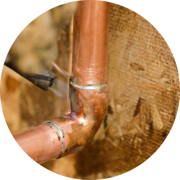 An Antrim Plumbing professional fixing a leaking water pipe, Water Leak Repair Services in Delaware County, PA