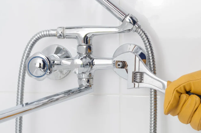 A man fixing a shower system, Shower Installation Repair and Services in The Delaware County, PA