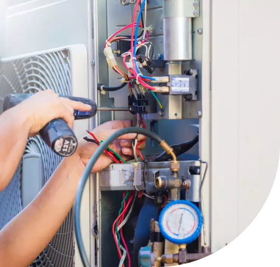 A man doing repair work on a home heating device, Home Heater Repair in Delaware County, PA