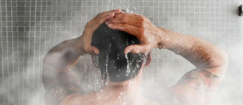 A man taking a hot shower