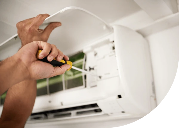 A man from Antrim Plumbing providing air conditioning repair services in greater Philadelphia.