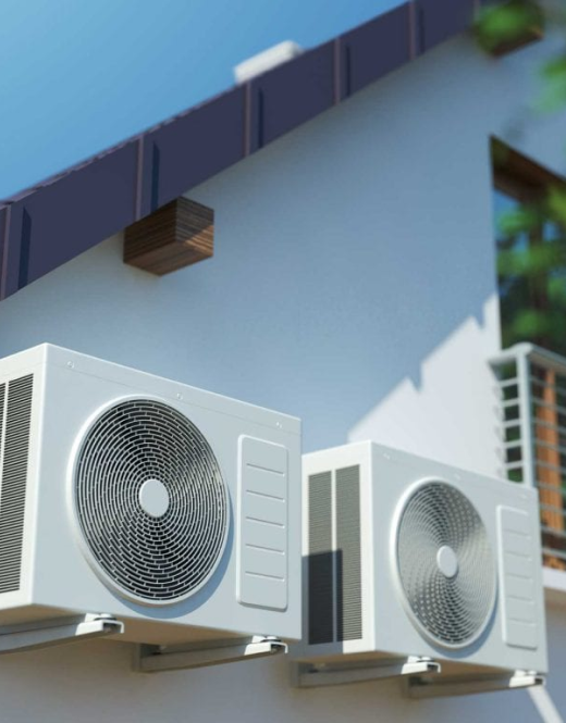 Two air conditioners on the side of a house requiring installation and repair services.