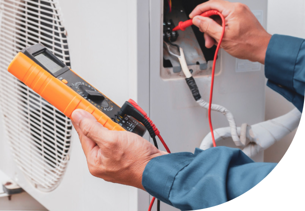 A picture of a man tuning a heat pump system, Heat Pump Services in Delaware County, PA