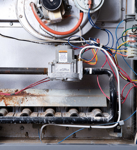 A gas furnace with electrical equipment and wires, Gas and Electric Furnace in Delaware County, PA